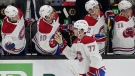 Montreal Canadiens center Kirby Dach (77) celebrates with teammates after scoring during the second period of an NHL hockey game against the Boston Bruins, Thursday, March 23, 2023, in Boston. (AP Photo/Steven Senne)