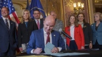 Gov. Spencer Cox signs two social media regulation bills during a ceremony at the Capitol building in Salt Lake City on Thursday, March 23, 2023. (Trent Nelson/The Salt Lake Tribune via AP)