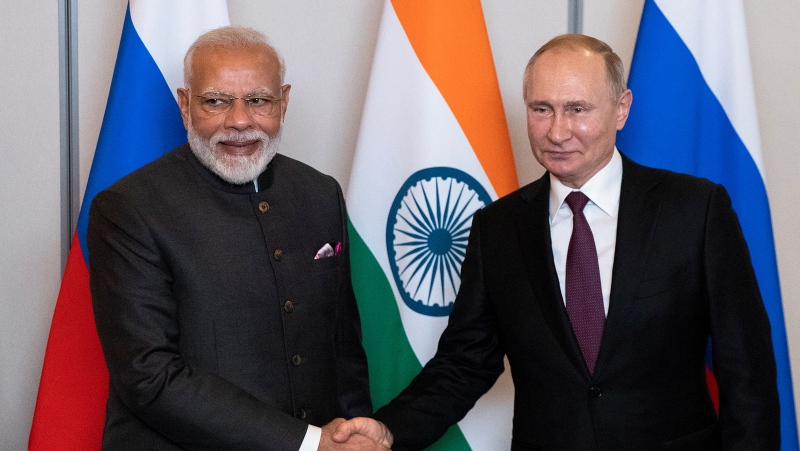 Russian President Vladimir Putin, right, shakes hands with Indian Prime Minister Narendra Modi during their meeting in Brasilia, Brazil, November 13, 2019. (Pavel Golovkin/Reuters/File)