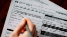 Eligible Torontonians can seek free help with their income tax returns. Here's how. THE CANADIAN PRESS/Chris Young