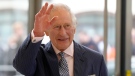 King Charles III waves as he arrives for a visit to the new European Bank for Reconstruction and Development (EBRD) in London, Thursday, March 23, 2023. (AP Photo/Kirsty Wigglesworth, pool)