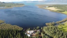 The Lemphers home surrounded by water at Shallow Bay on Lake Laberge, in this image taken with the use of a drone, Whitehorse, Yukon on Monday July 12, 2021. THE CANADIAN PRESS/Crystal Schick