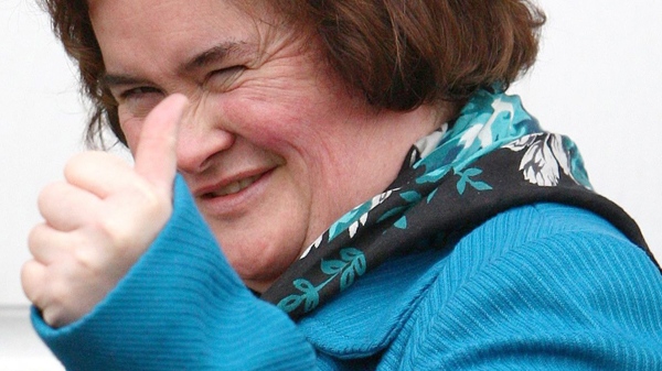 Singer Susan Boyle gives a thumbs up sign outside her house in Blackburn, Scotland, Wednesday Jan. 27, 2010. (AP / Andrew Milligan)