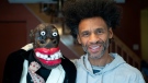 Artist Franck Sylvestre poses with puppet Max at his home in Montreal, Saturday, March 18, 2023. A theatre performance for children featuring a puppet that has been described as racist is continuing in the Montreal area. Several Black community organizations have criticized the puppet as being reminiscent of blackface minstrel shows. THE CANADIAN PRESS/Graham Hughes
