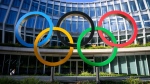 Olympic Rings are pictured in front of The Olympic House, headquarters of the International Olympic Committee (IOC) at the opening of the executive board meeting of the International Olympic Committee (IOC), in Lausanne, Switzerland, Thursday, September 8, 2022. (Laurent Gillieron/Pool via AP)