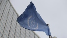 The flag of the International Atomic Energy Agency flies in front of its headquarters during an IAEA Board of Governors meeting in Vienna, Austria, Feb. 6, 2023. (AP Photo/Heinz-Peter Bader)