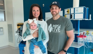 The Gilroy family, Rebecca (left) holding Emma and survivor Sean, at Health Sciences North in March 2023. (Alana Everson/CTV News Northern Ontario)