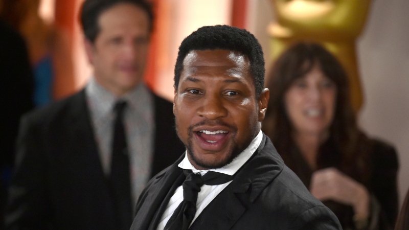 Jonathan Majors arrives at the Oscars on Sunday, March 12, 2023, at the Dolby Theatre in Los Angeles. (Photo by Richard Shotwell/Invision/AP)