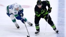 Vancouver Canucks center Elias Pettersson (40) defends against Dallas Stars center Joe Pavelski (16) during the third period of an NHL hockey game in Dallas, Saturday, March 25, 2023. (AP Photo/LM Otero)
