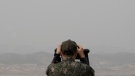 A South Korean army soldier watches the North Korea side from the Unification Observation Post in Paju, South Korea, near the border with North Korea, Friday, March 24, 2023. (AP Photo/Ahn Young-joon)