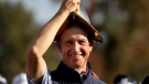David Toms tries on the championship trophy after holding on to win the PGA Tour Champions' Cologuard Classic golf tournament over Robert Karlsson in Tucson, Ariz., Sunday, March 5, 2023. (Kelly Presnell/Arizona Daily Star via AP)
