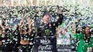 Tyler Reddick, centre, celebrates after winning a NASCAR Cup Series auto race at Circuit of the Americas, Sunday, March 26, 2023, in Austin, Texas. (AP Photo/Stephen Spillman)