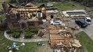 Debris is strewn about a tornado damaged home, Sunday, March 26, 2023, in Rolling Fork, Miss. (AP Photo/Julio Cortez)
