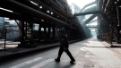 A worker walks inside the Zaporizhstal steel plant, in Zaporizhia, Ukraine, March 1, 2023. (AP Photo/Thibault Camus)