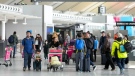 People are shown at Pearson International Airport in Toronto on Friday, March 10, 2023. THE CANADIAN PRESS/Nathan Denette