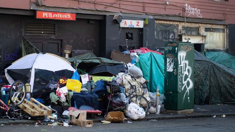 FILE: Tents line the sidewalk on East Hastings Street in the Downtown Eastside of Vancouver, on Thursday, July 28, 2022. THE CANADIAN PRESS/Darryl Dyck