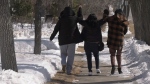 Odelia and Nerissa Quewezance walk away from the Yorkton Court of King's Bench with their sister, immediately following their bail decision on March 27, 2023. (Brady Lang/CTV News) 