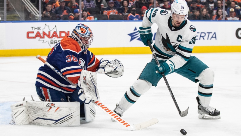 San Jose Sharks' Logan Couture (39) is stopped bys Edmonton Oilers goalie Jack Campbell (36) during third period NHL action in Edmonton on Monday March 20, 2023.THE CANADIAN PRESS/Jason Franson
