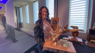 Hunter Frankfurt with her award at the Saskatchewan Bow Hunters Association Banquet on March 25, 2023. (Luke Simard/CTV News)