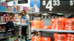 A worker organizes items at a Walmart Supercenter in North Bergen, N.J., on Feb. 9, 2023. (AP Photo/Eduardo Munoz Alvarez, File) 