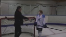 Young hockey star practices in backyard rink