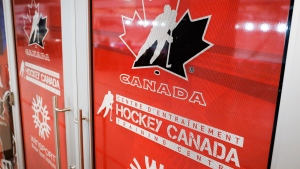 A Hockey Canada logo is seen on the door to a training facility at the organizations head office in Calgary, Alta., Sunday, Nov. 6, 2022. THE CANADIAN PRESS/Jeff McIntosh
