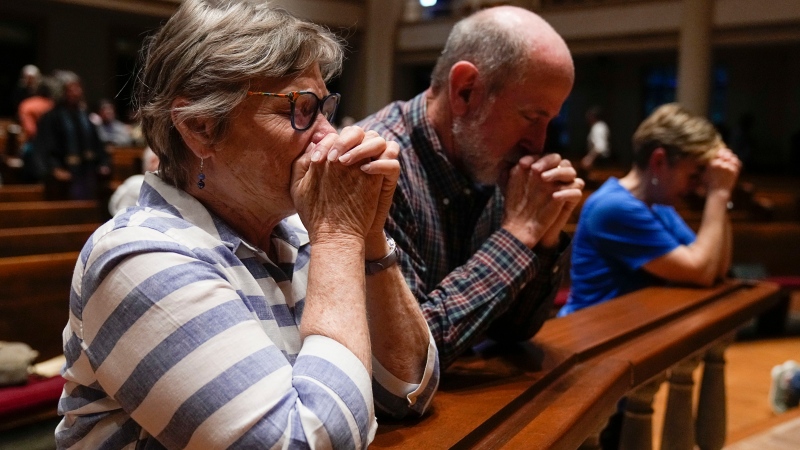Pastor Paul Purdue participate in a community vigil at Belmont United Methodist Church in the aftermath of school shooting in Nashville, Monday, March 27, 2023, in Nashville, Tenn.. (AP Photo/John Bazemore)(AP Photo/John Bazemore) 