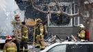 Firefighters attend the scene of a house explosion that injured several people, destroyed one home and damaged others in Calgary, Alta., Monday, March 27, 2023.THE CANADIAN PRESS/Jeff McIntosh 