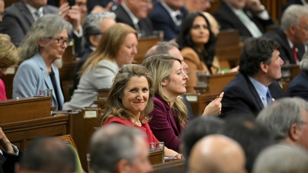 Chrystia Freeland, Deputy Prime Minister and Minister of Finance, left, and Foreign Minister Melanie Joly wait for an address from U.S. President Joe Biden at Parliament in Ottawa, Canada, Mach 24, 2023. (Mandel Ngan/Pool via AP)