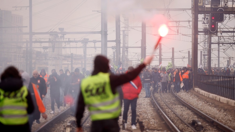 Railway workers demonstrate on the tracks at the Gare de Lyon train station in Paris, on March 28, 2023. (Thomas Padilla / AP) 