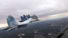 In this photo taken from video provided by the Russian Defence Ministry Press Service on Thursday, Feb. 17, 2022, Su-30 fighters of the Russian and Belarusian air forces fly in a joint mission during the Union Courage-2022 Russia-Belarus military drills in Belarus. (Russian Defense Ministry Press Service via AP, File)