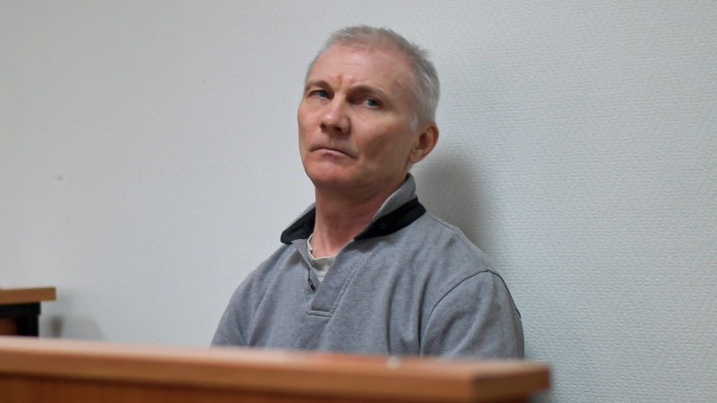Alexei Moskalyov sits in a courtroom in Yefremov, Tula region, some 300 kilometres (186 miles) south of Moscow, Russia, Monday, March 27, 2023.  (AP Photo)