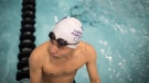 Club member Alex Jung rests at a break between laps during a swim session hosted by Toronto Purple Fins at Wellesley Community Centre Pool in Toronto, on Thursday, March 23, 2023. (THE CANADIAN PRESS/ Tijana Martin)