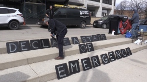 Dozens of Londoners were outside city hall in London, Ont. on March 28, 2023 calling for a state of emergency on housing. (Daryl Newcombe/CTV News London)