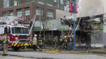 Firefighters battle a suspicious blaze at a commissary kitchen on East Hastings Street, in Vancouver, B.C., on March 25, 2023. 