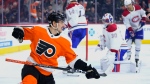 Philadelphia Flyers' Morgan Frost, left, reacts after scoring a goal during the second period of an NHL hockey game against the Montreal Canadiens, Tuesday, March 28, 2023, in Philadelphia. (AP Photo/Matt Slocum)