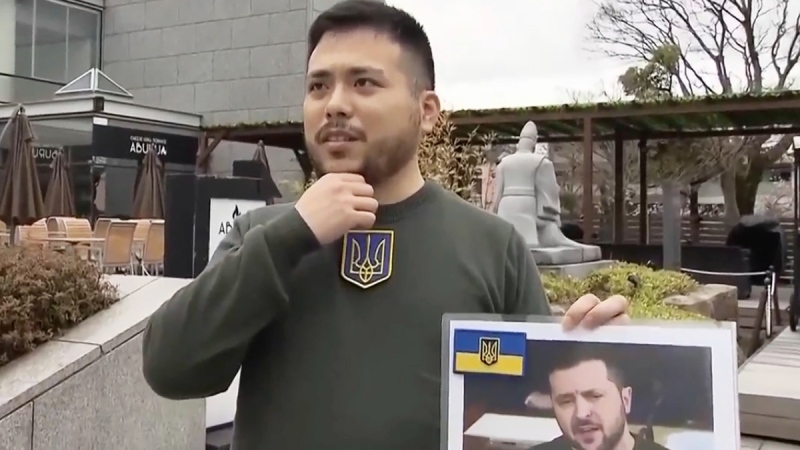 A Japanese student explains why he chose to be Ukrainian President Volodymyr Zelenskyy's lookalike for his graduation ceremony in Kyoto, Japan, on March 24, 2023. (NTV via AP) 