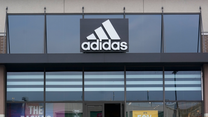 A sign is displayed in front of an Adidas retail store in Paramus, N.J., Oct. 25, 2022. (AP Photo/Seth Wenig)
