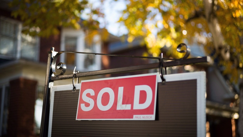 A real estate sold sign hangs in front of a west-end Toronto property on Nov. 4, 2016. (THE CANADIAN PRESS/Graeme Roy)