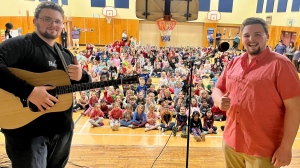 The Turnball twins perform at St. Anne's Elementary School in Glace Bay, N.S. (Kyle Moore/CTV Atlantic)