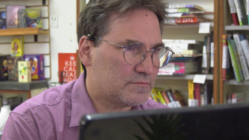 David Worsely, co-owner of Words Worth Books in Uptown Waterloo, is no stranger to the fees associated with credit cards. (CTV Kitchener/Spencer Turcotte)