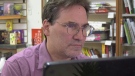 David Worsley, co-owner of Words Worth Books in Uptown Waterloo, is no stranger to the fees associated with credit cards. (CTV Kitchener/Spencer Turcotte)