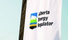 The Alberta Energy Regulator logo is seen on a flag at the opening of the regulator's office in Calgary in an undated handout photo. Alberta's energy regulator is defending its finding that the province's largest recorded earthquake was caused by oilpatch activity. THE CANADIAN PRESS/HO-Alberta Energy Regulator