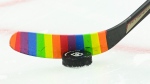An Ottawa Senators player warms-up with rainbow coloured hockey tape as part of a #HockeyIsForEveryone campaign prior to taking on the Vancouver Canucks in NHL hockey action in Ottawa on Wednesday, April 28, 2021. The Vancouver Canucks will wear themed warm-up jerseys when they host the Calgary Flames for their annual Pride celebration game Friday. THE CANADIAN PRESS/Sean Kilpatrick