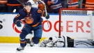 Los Angeles Kings goalie Jonathan Quick, right, lies on the ice as Edmonton Oilers centre Connor McDavid celebrates his goal during third period NHL playoff hockey action in Edmonton, Saturday, May 14, 2022.THE CANADIAN PRESS/Jeff McIntosh