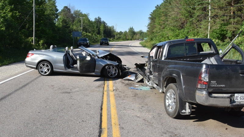 A pickup truck and convertible car are pictured after a deadly head-on collision on Highway 12 in Waubaushene, Ont., on July 4, 2020. (Source: OPP/Court Exhibit)
