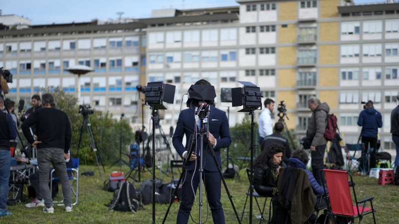 Members of the media set up their gear outside the Agostino Gemelli hospital under the rooms on the top floor normally used when a pope is hospitalised, in Rome, Thursday, March 30, 2023, after The Vatican said Pope Francis has been taken there in the afternoon for some scheduled tests. (AP Photo/Andrew Medichini)