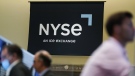 An NYSE sign is seen on the floor at the New York Stock Exchange in New York, Wednesday, June 15, 2022. (AP Photo/Seth Wenig, File)