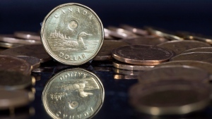 Canadian dollar coins are displayed in Montreal, on January 30, 2015. (Paul Chiasson / THE CANADIAN PRESS)