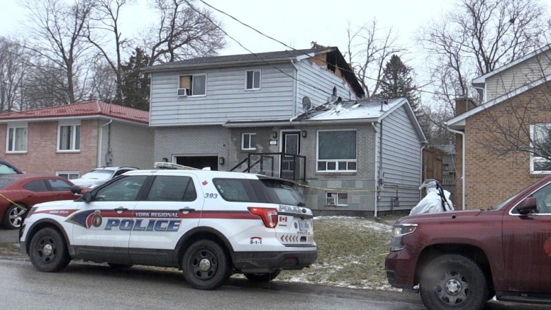 York Regional Police and an investigator with the Ontario Fire Marshal's office are investigating a house fire in Keswick, Ont., on Fri., March 31, 2023. (CTV News/Steve Mansbridge)